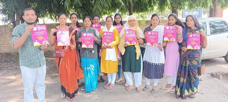 Women holding up pink campaign leaflets outside a building