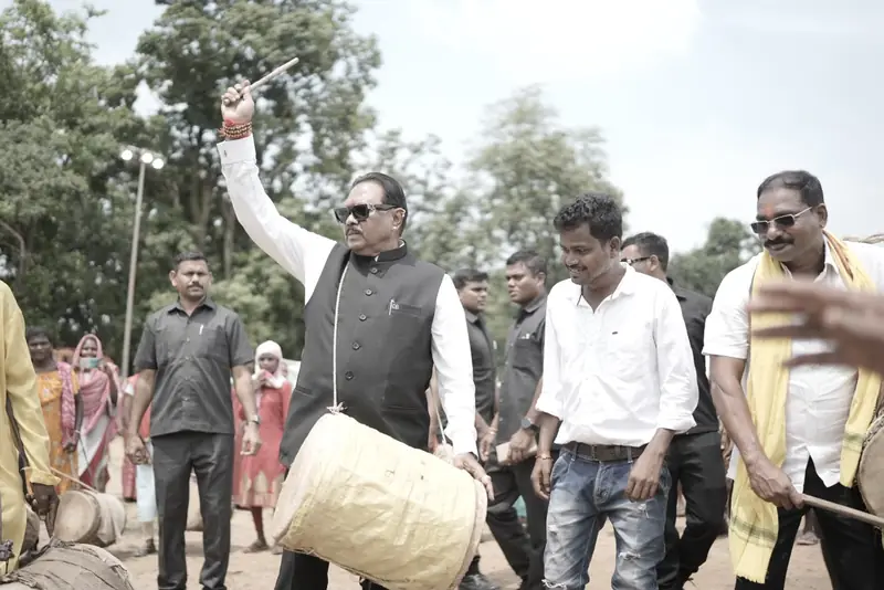Leaders and supporters playing drums during a village visit